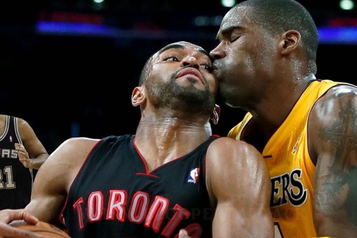 Basketball player receiving an accidental forehead kiss