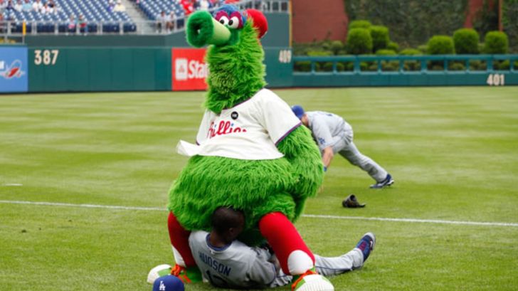 Mascot playfully covering a player