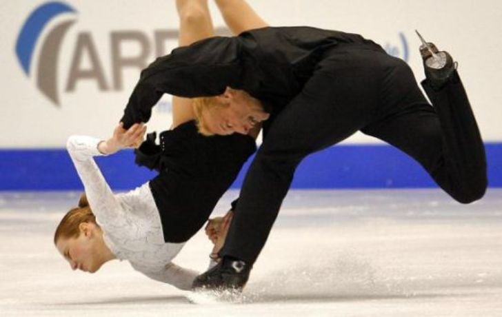 Pairs skaters mid-fall at European Championships