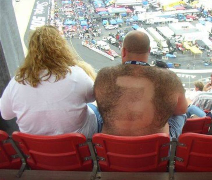 Fan with number 3 shaved into back hair