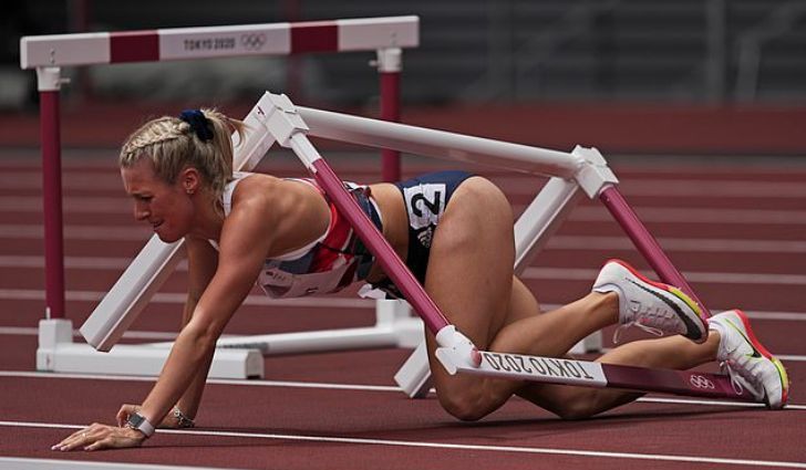 Sprinter going under a hurdle