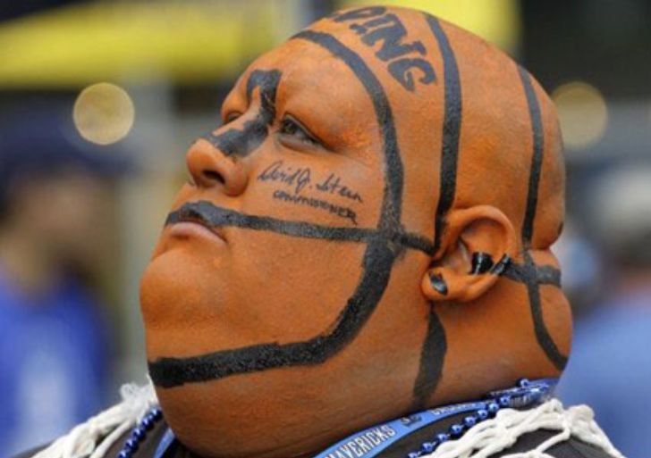 Fan with head painted like a basketball