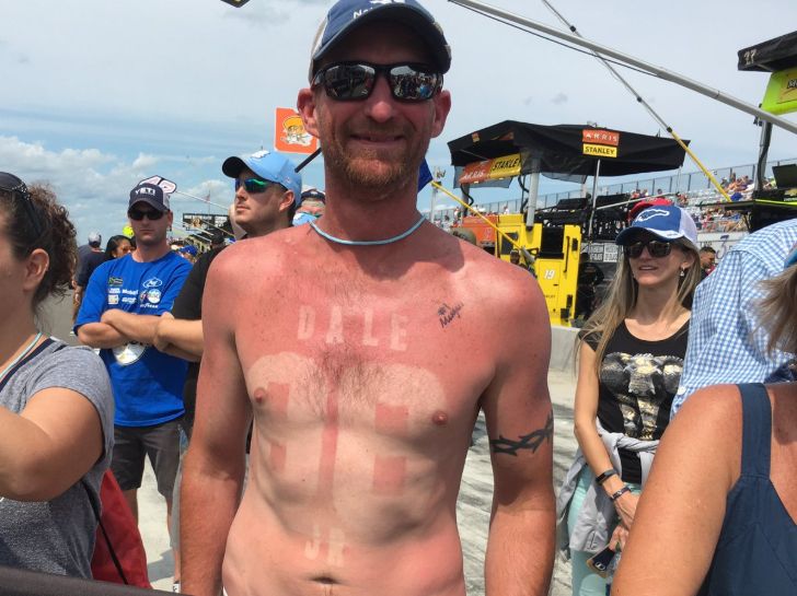 Fan with stencil tan lines like a jersey