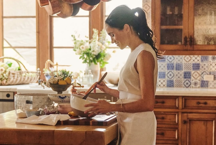Meghan Markle cooking in kitchen scene